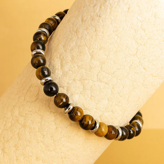 Tiger eye–tone bead bracelet with polished metallic spacers, product detail view