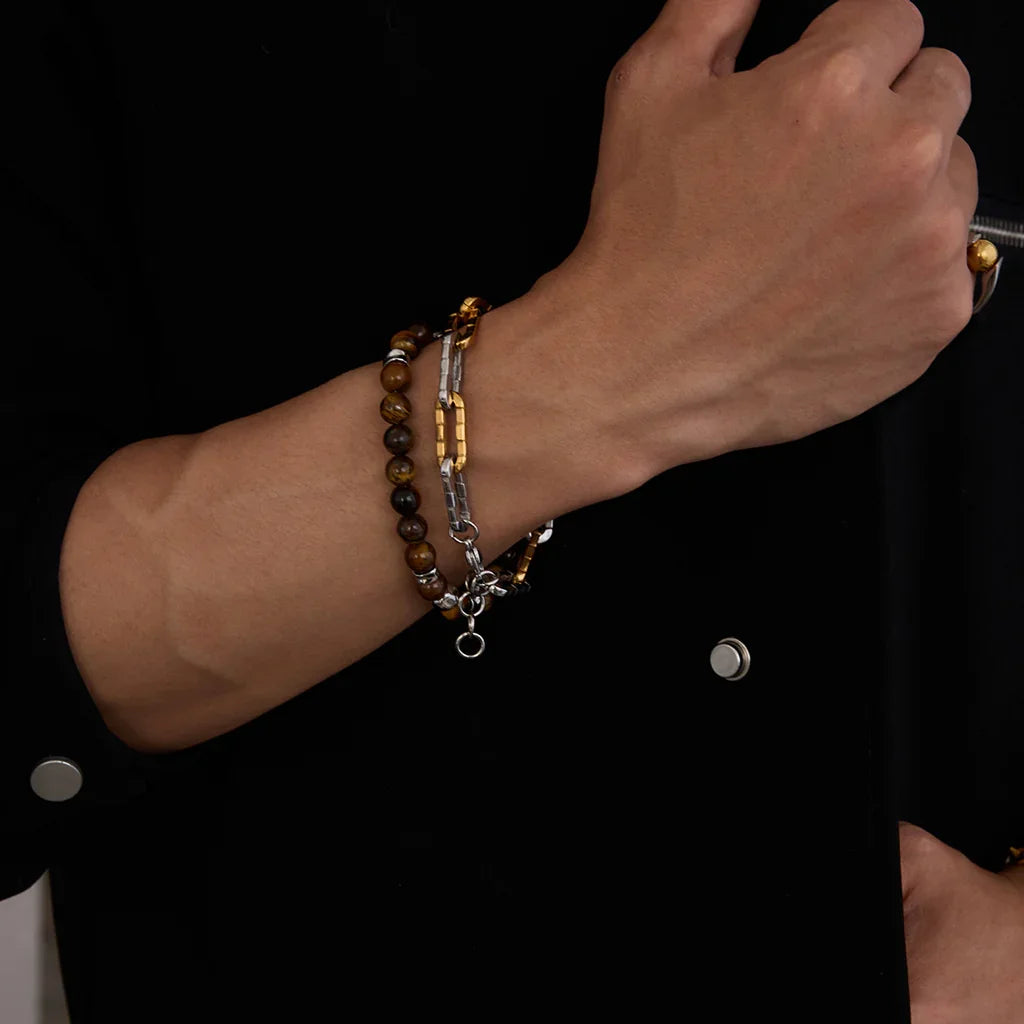 Two-tone 18K gold-plated stainless steel chain bracelet styled on wrist, textured links with polished finish