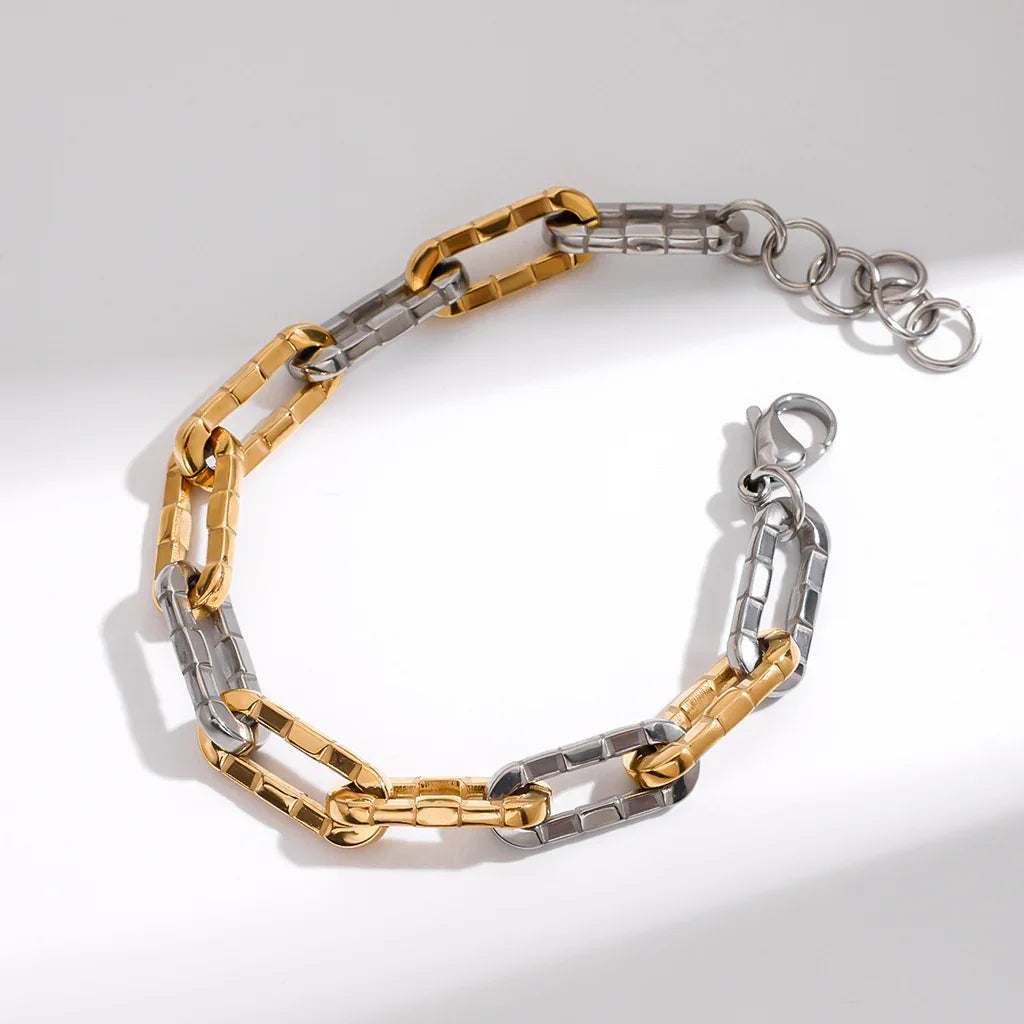 Two-tone 18K gold-plated stainless steel textured chain bracelet, close-up product view on light background