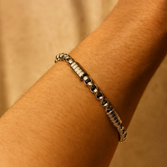 Gold-plated chain link bracelet on wrist, minimal masculine chain design