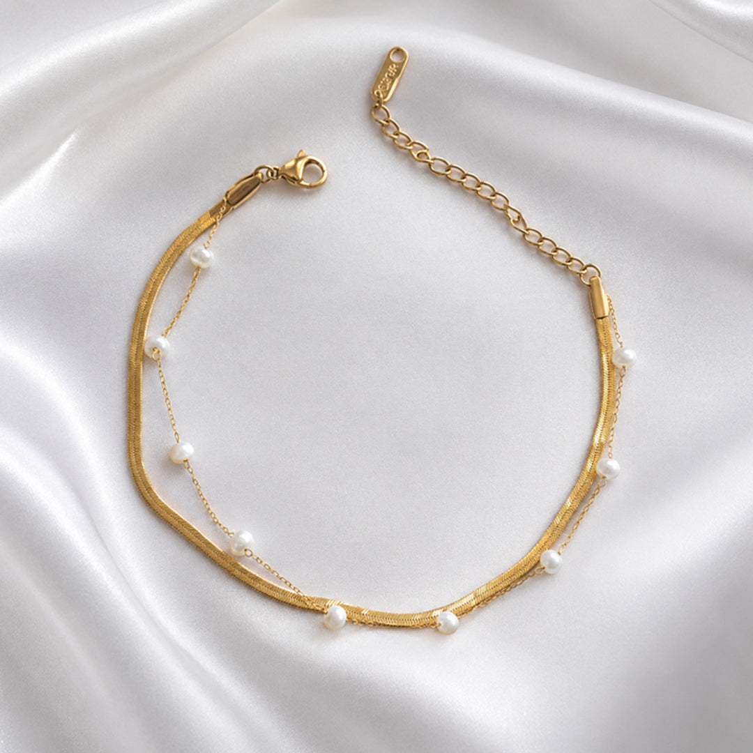 Selene Anklet featuring a layered 18K PVD gold plated snake chain with delicate pearl accents.