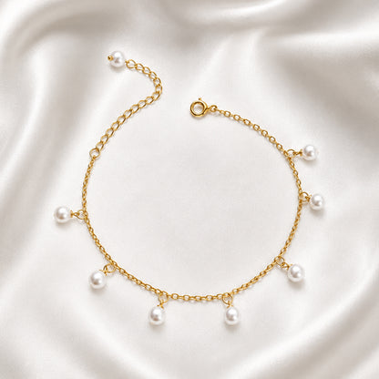Pearla Anklet in 18K PVD gold plating featuring delicate dangling pearl charms.