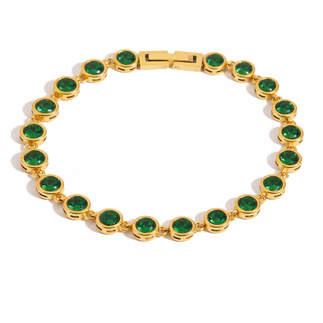 Gold tennis bracelet with emerald green bezel-set zircon stones and polished box clasp