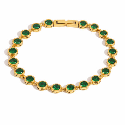 Gold tennis bracelet with emerald green bezel-set zircon stones and polished box clasp