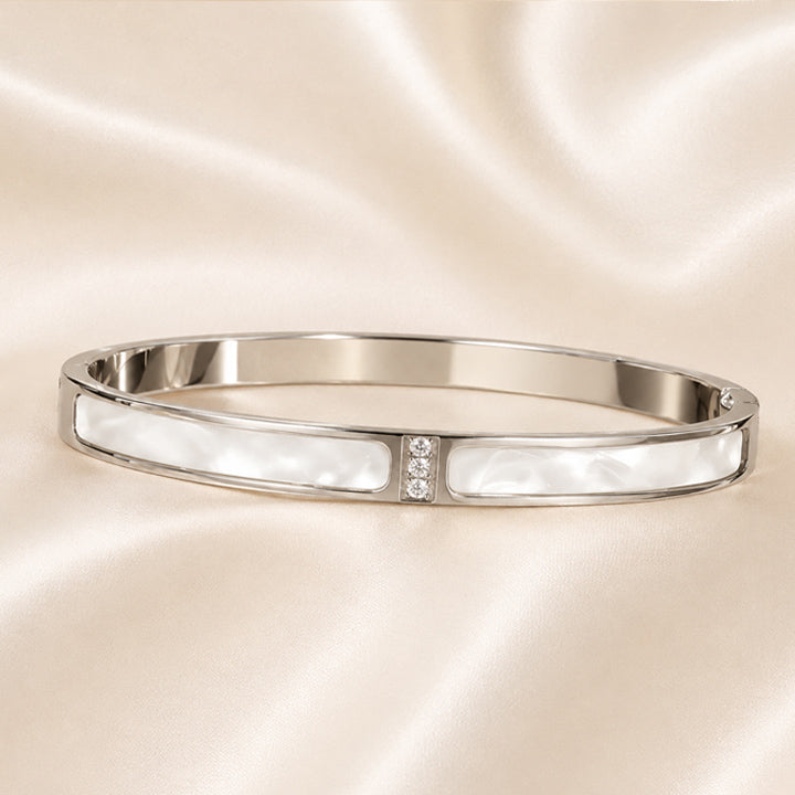 Celeste White Enamel Bangle with glossy enamel inlays and crystal accents in polished Stainless Steel finish.