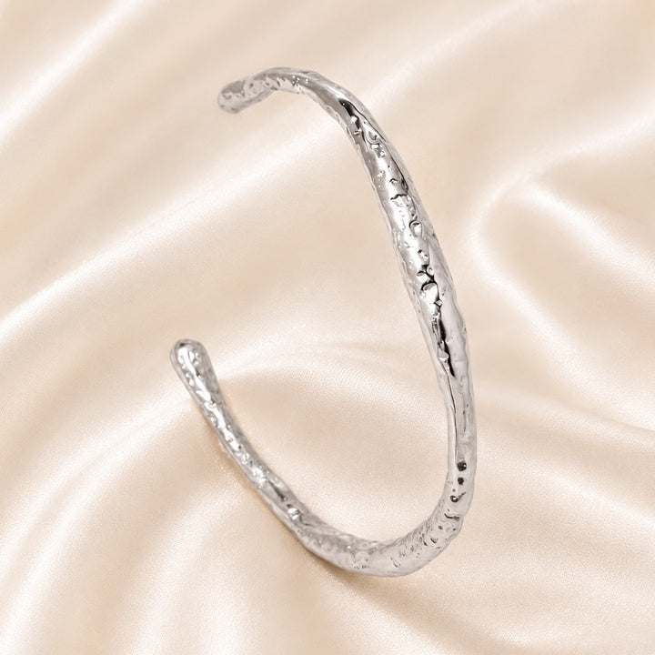 Celeste Organic Texture Cuff in polished Stainless Steel with artisanal hammered finish.