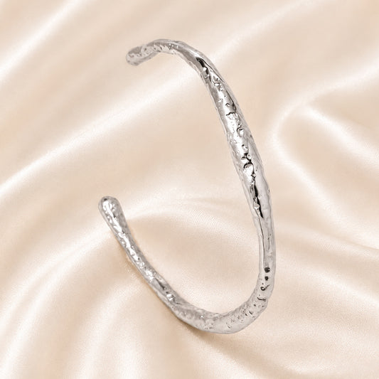 Celeste Organic Texture Cuff in polished Stainless Steel with artisanal hammered finish.