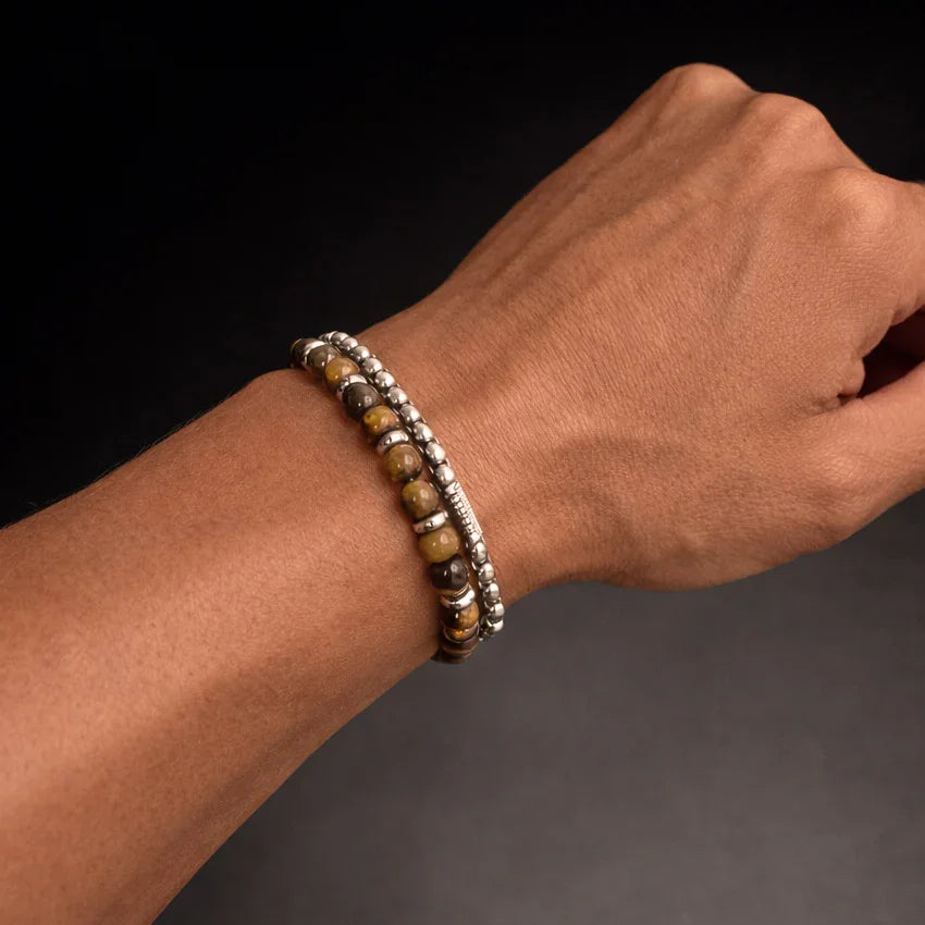 Men’s tiger eye bead bracelet stacked with silver-toned bead bracelet, minimal styling