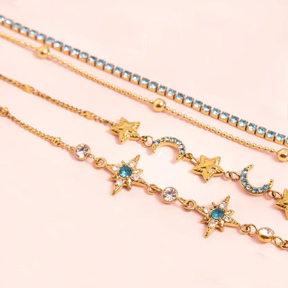 Close-up of star and crescent motif chain bracelets with turquoise zircon accents, gold-plated set