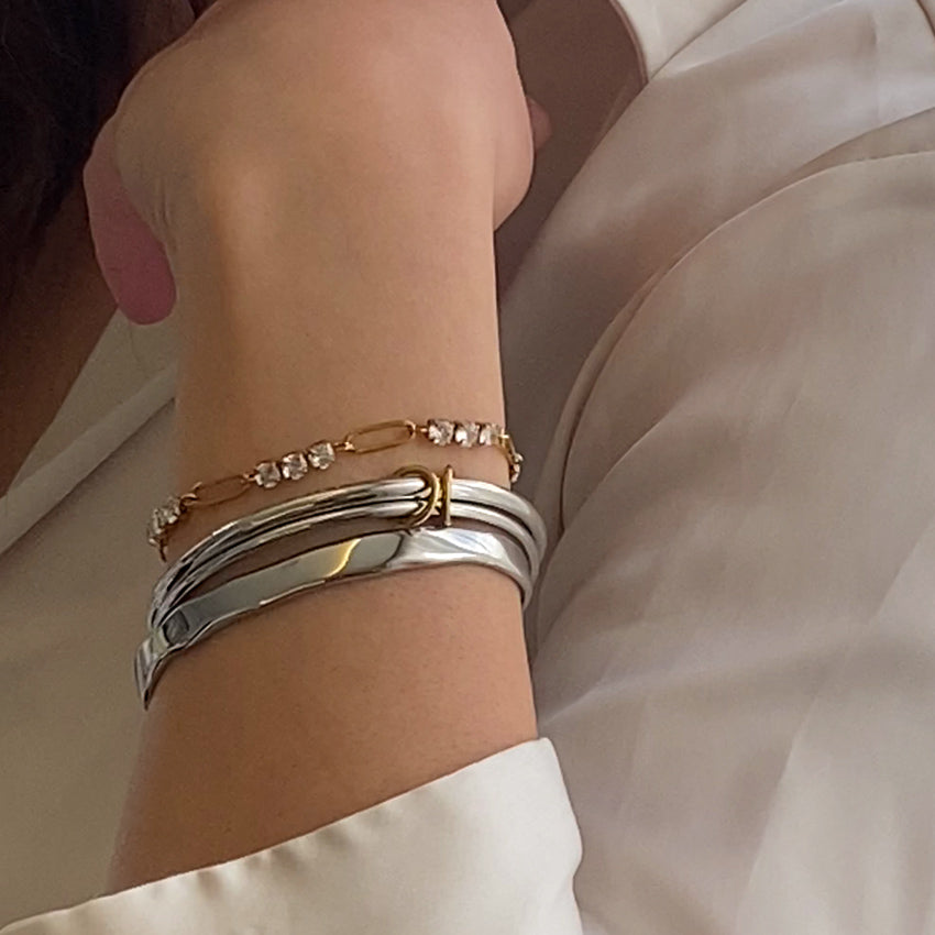 Trinity Double Tone bangle styled in a coordinated stack