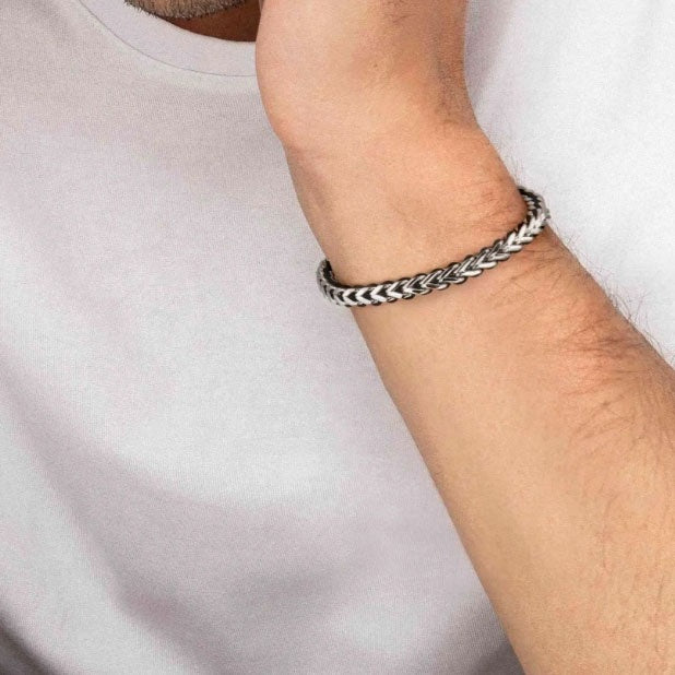 Stainless steel curb chain men’s bracelet with black thread detail and adjustable sliding closure