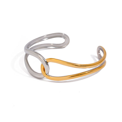 Two-toned silver and gold bracelet on a white background