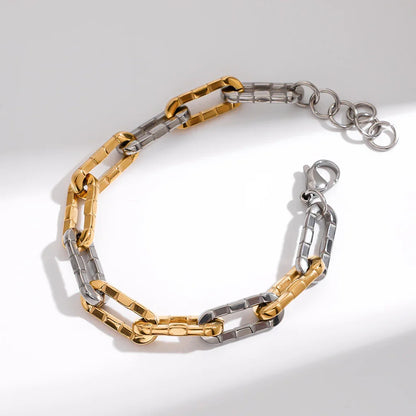 Two-tone 18K gold-plated stainless steel textured chain bracelet, close-up product view on light background