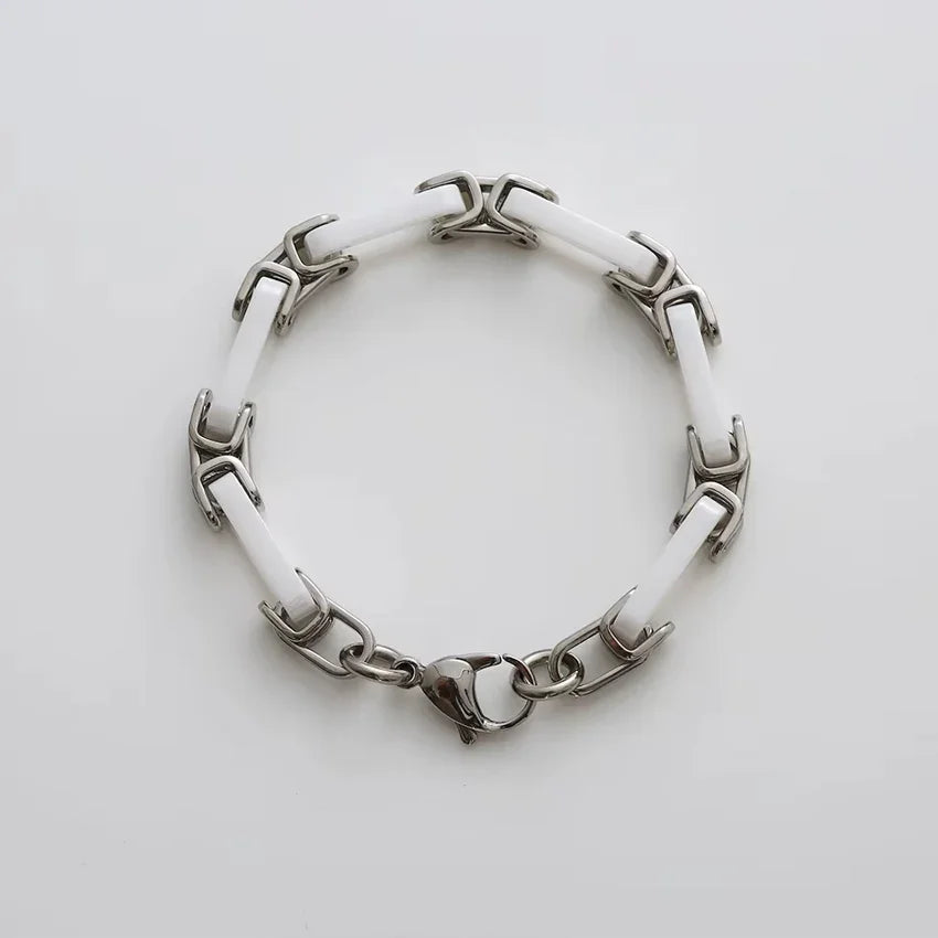 White ceramic chain bracelet top view showing ceramic links and steel connectors