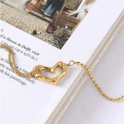 OROR heart chain bracelet styled flat lay, stainless steel with PVD gold finish