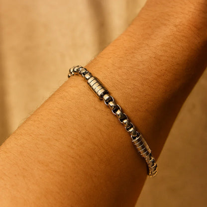 Gold-plated chain link bracelet on wrist, minimal masculine chain design