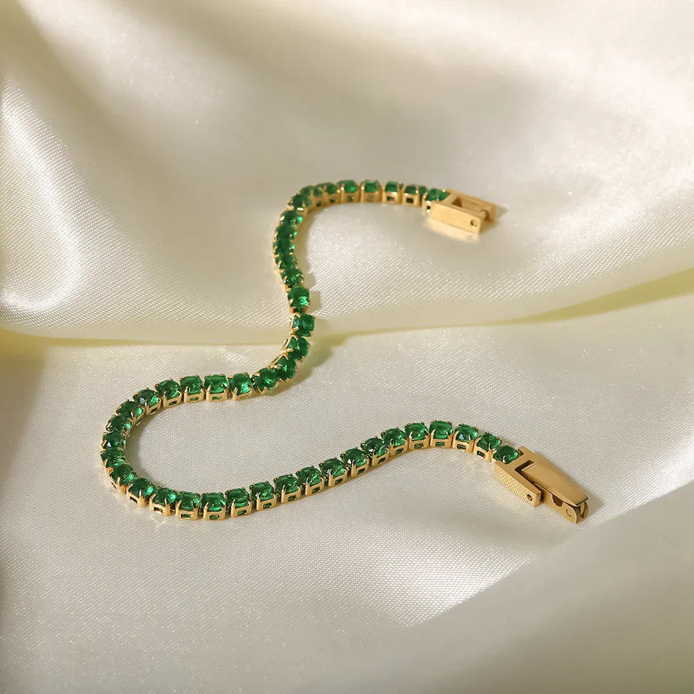 Emerald green tennis bracelet close-up, square-cut stones in a clean line