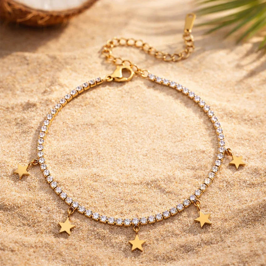Étoile Signature pavé bracelet flat lay, gold-plated crystal line with sculpted star accents