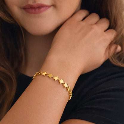 old-plated star link bracelet on wrist, Astra sculpted star design